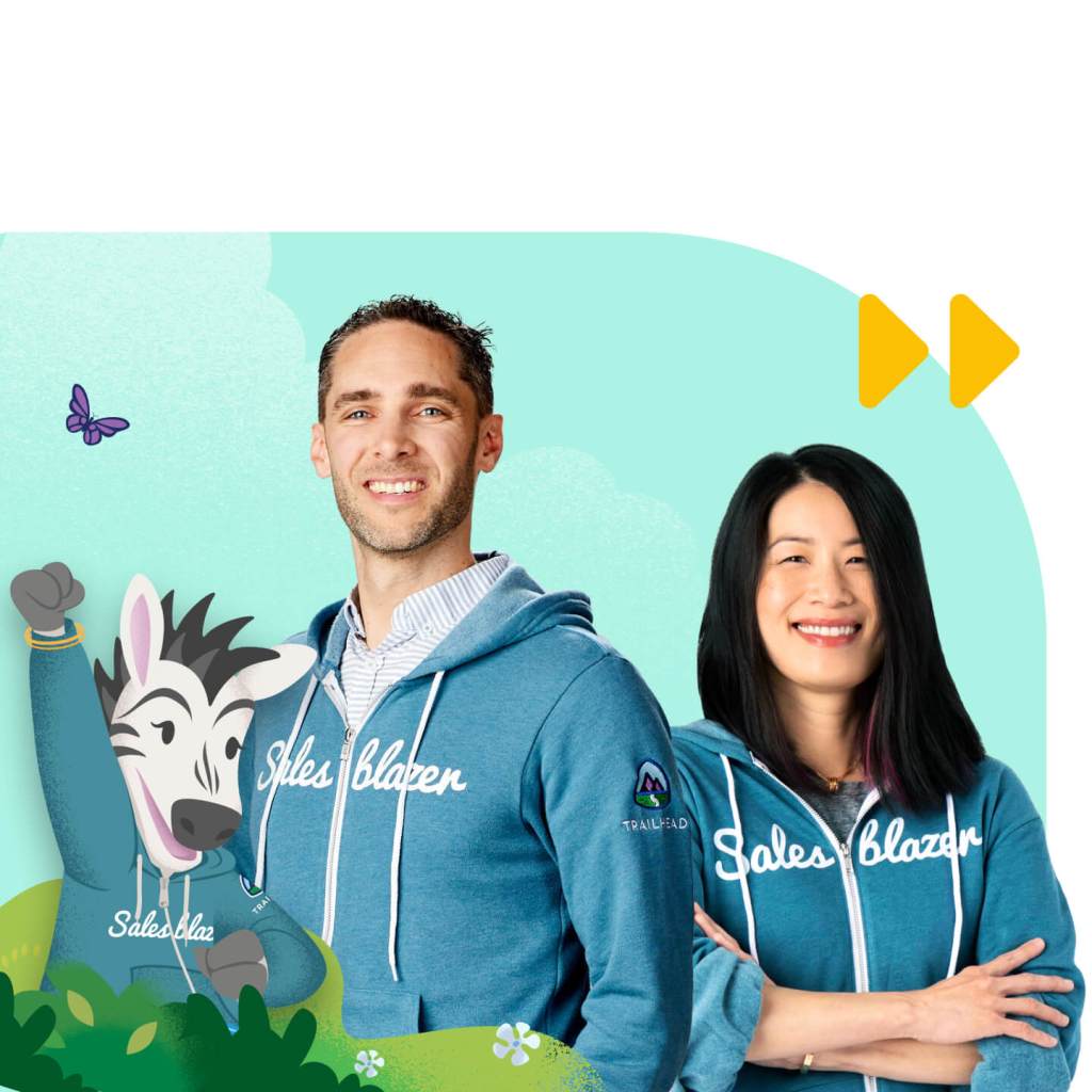 Two Salesblazers in blue sweatshirts, smiling and standing next to Salesforce mascot Zig the Zebra.